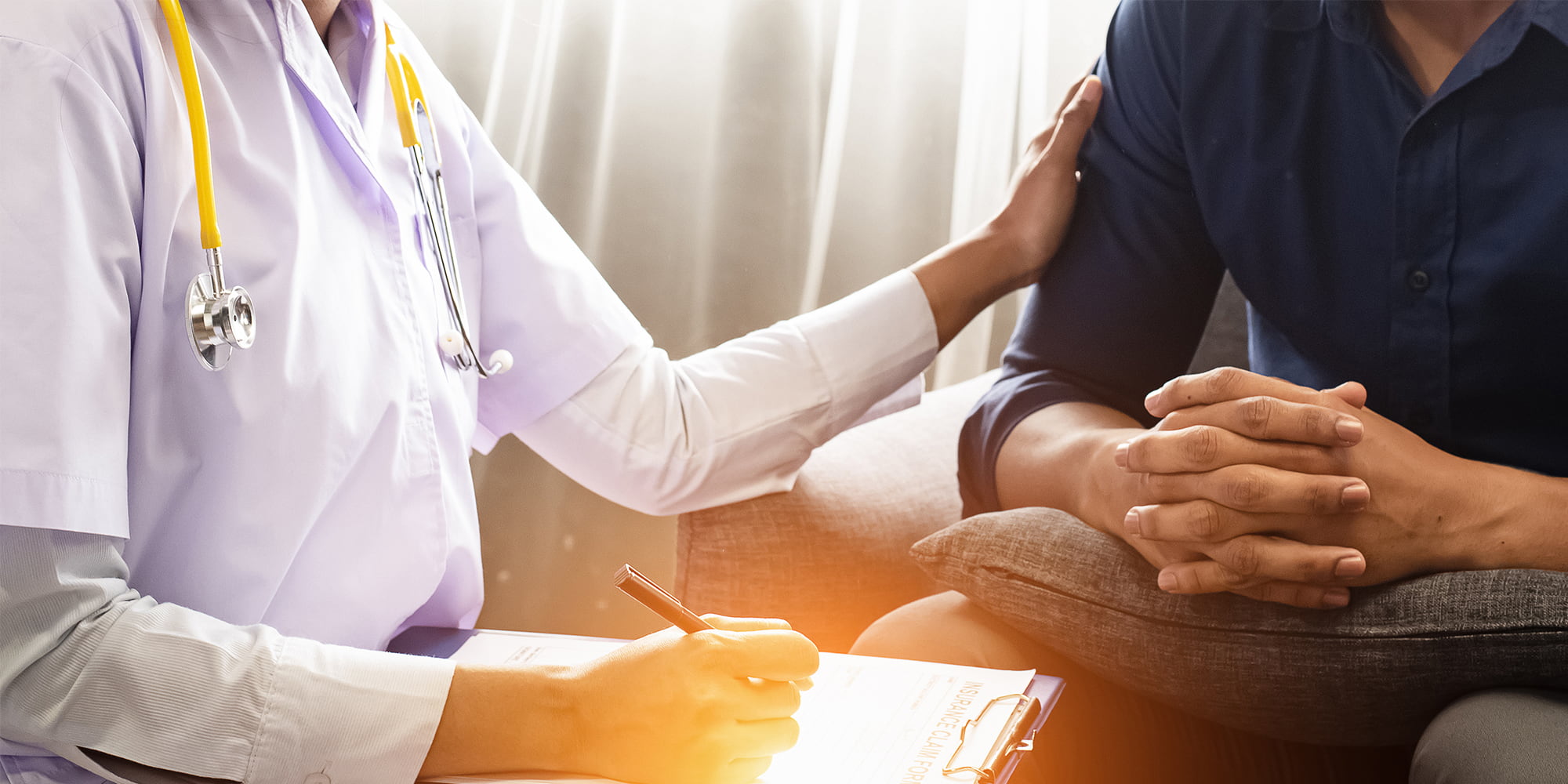 A clinician reassuring a patient during a fentanyl addiction assessment at Great Plains Recovery