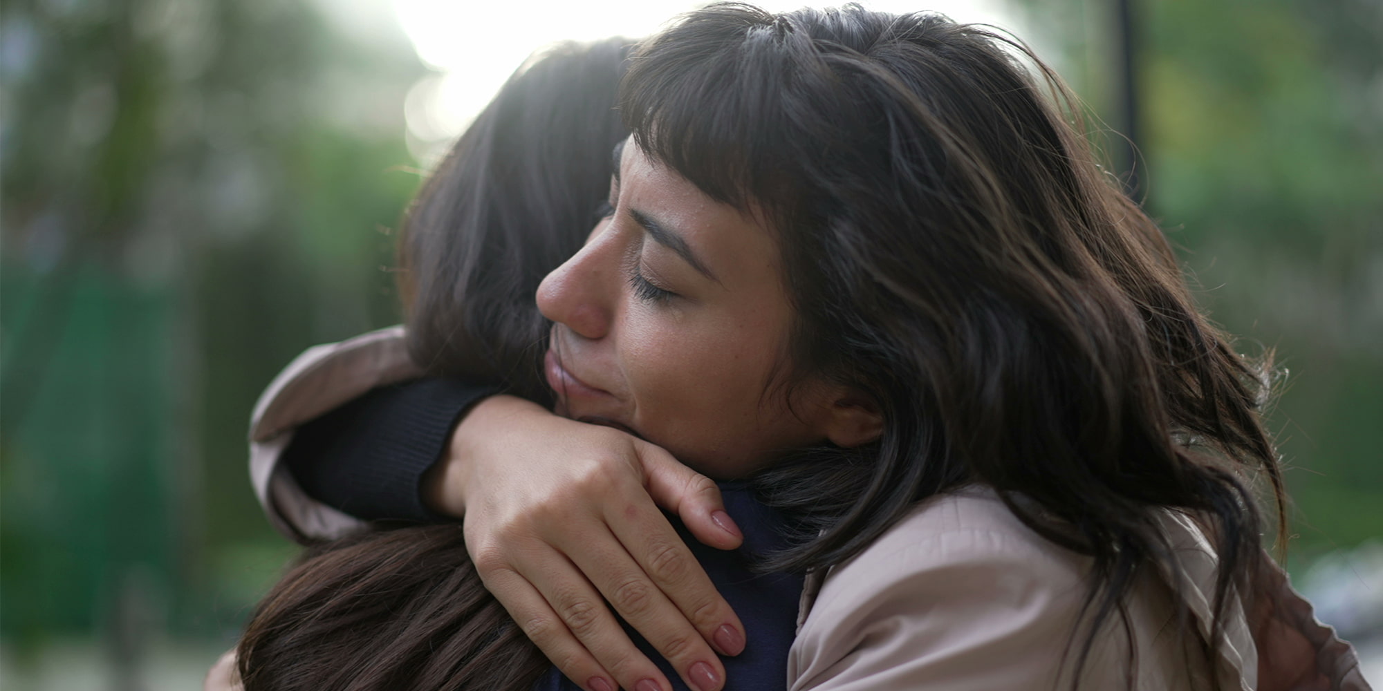 Two women embracing in support during residential treatment at Great Plains Recovery